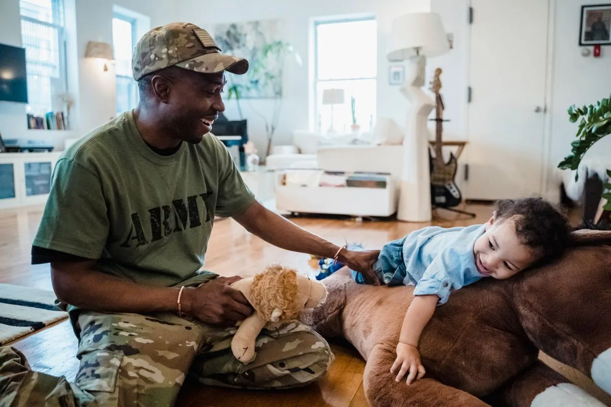 A joyful moment of a father and child playing together at home, enjoying toys.